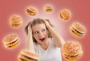 girl with hamburgers flying around her head