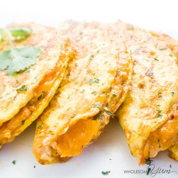 Spicy Cauliflower Quesadillas served with herbs sprinkled over the serving dish