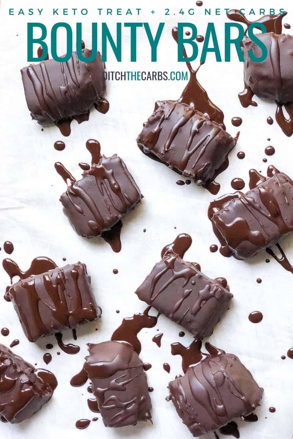 chocolate coated keto bounty bars on baking parchment