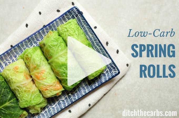 Three cabbage spring rolls on a blue plate