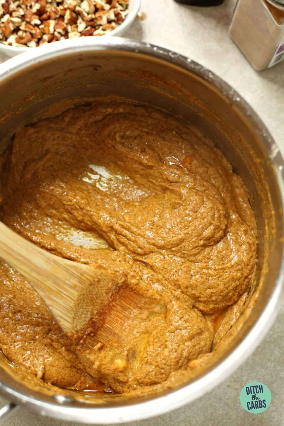 mixing sugar-free pumpkin pie fudge in a small saucepan