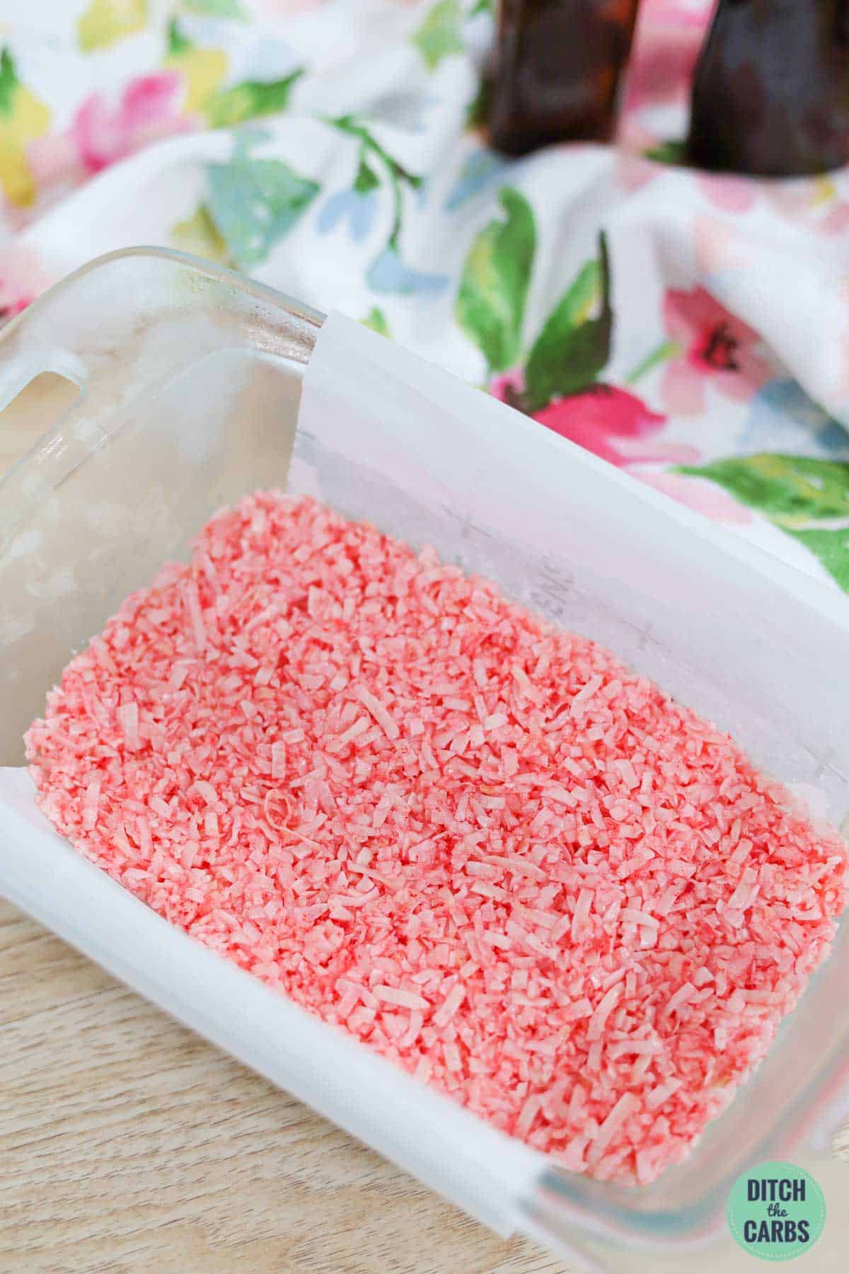 a bowl of the pink layer of coconut ice