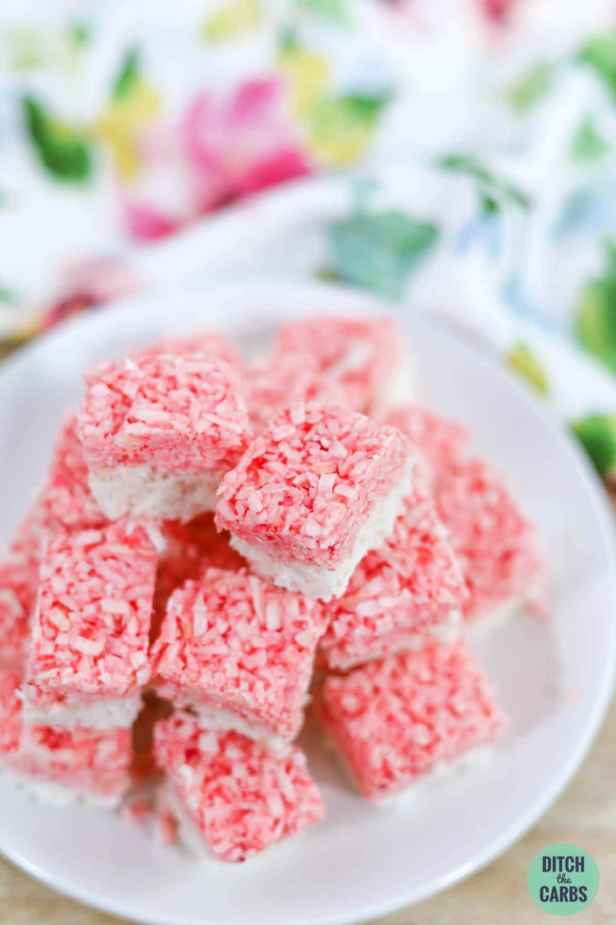 sugar-free coconut ice cut into squares on a white plate
