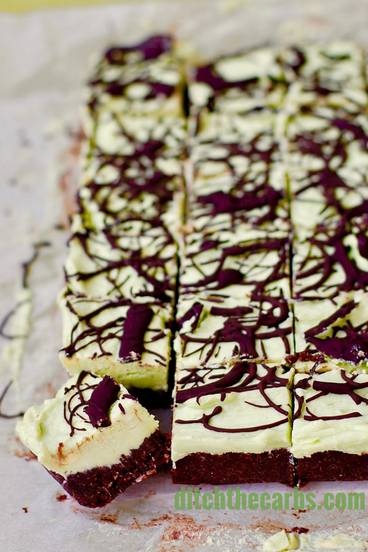 no-bake chocolate peppermint cheesecake squares on parchment paper