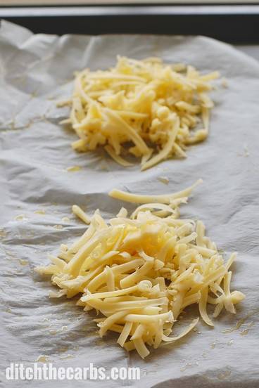 A close up of shredded cheese on a baking tray