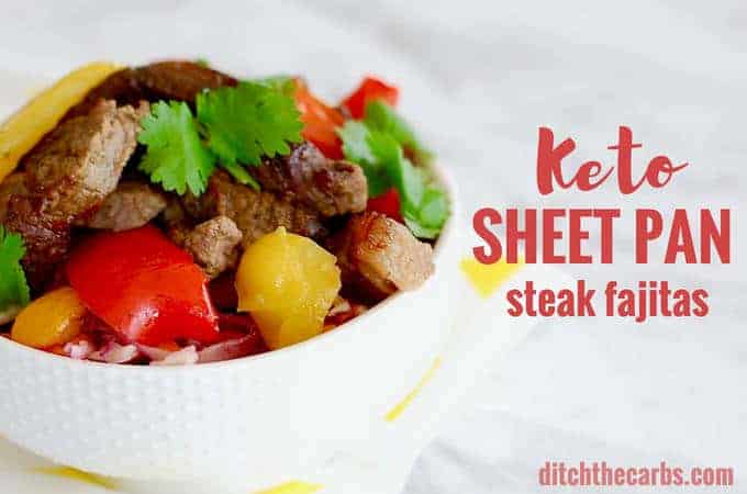 Bowl of keto sheet pan steak fajitas garnished with herbs and colourful vegetables