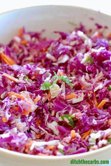 A close up of a bowl of salad, with Mexican coleslaw
