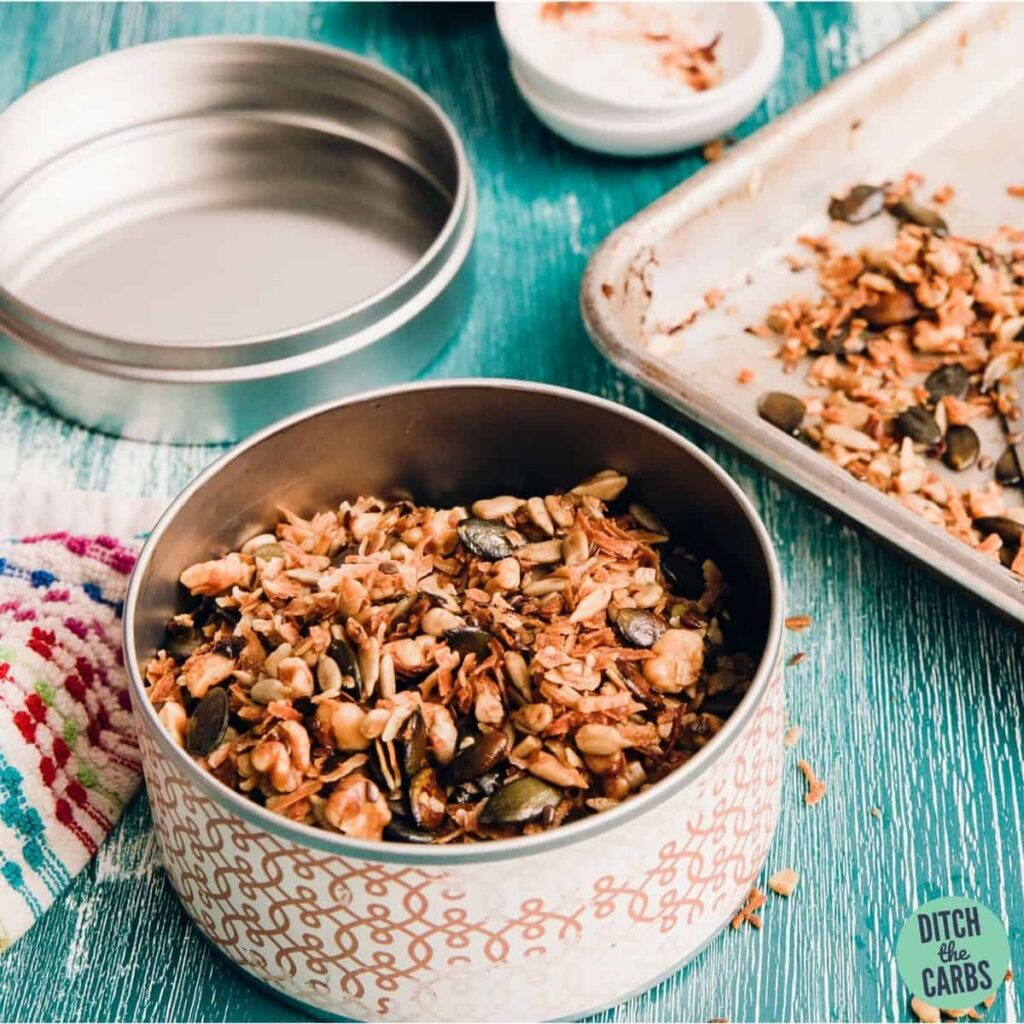 Homemade grain-free granola ingredients in a tin