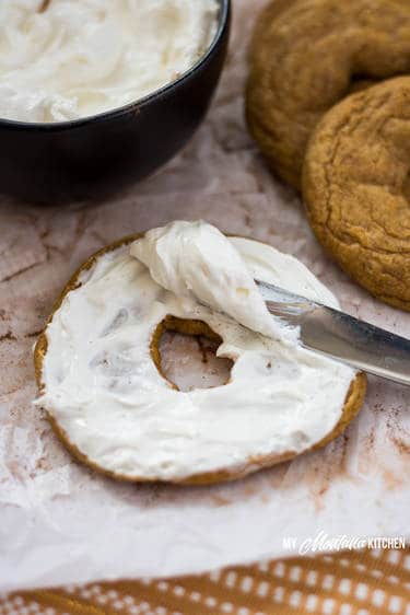 Low carb pumpkin bagel sliced and served with cream cheese