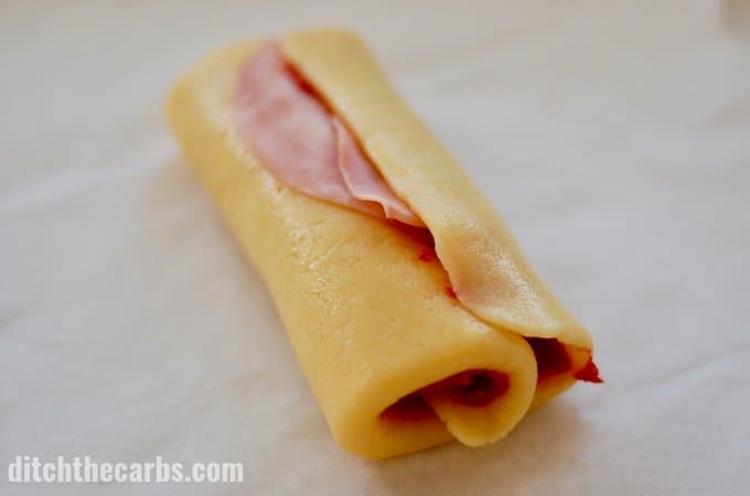 Mozzarella dough rolled around sliced ham and tomato paste