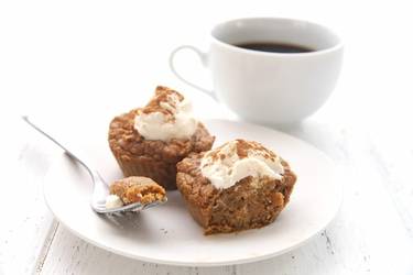 Pumpkin muffins served with cream cheese and a cup of coffee