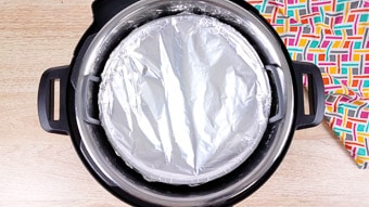 Chocolate self saucing pudding covered with foil in the Instant Pot 