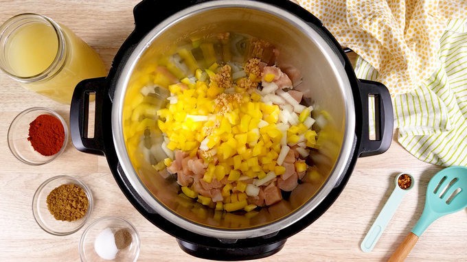 Chicken taco soup ingredients in the Instant Pot bowl