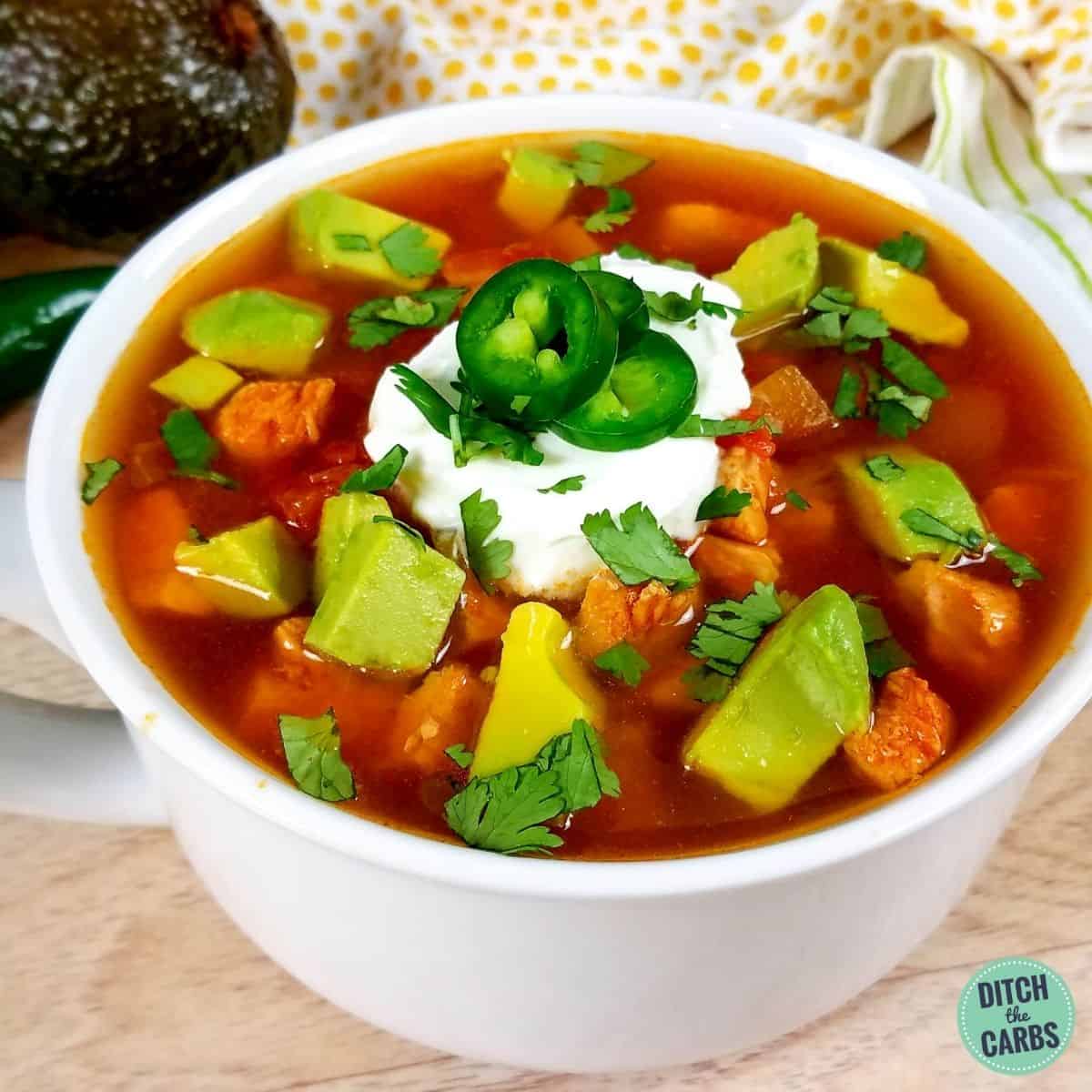 1-minute Low-Carb Instant Pot Chicken Taco Soup served in a white bowl