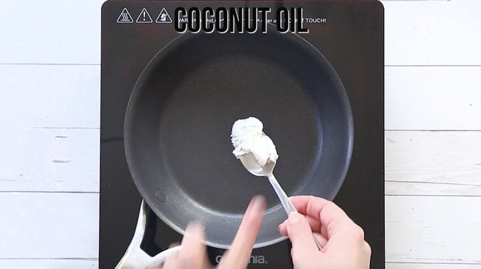 frying pan meting coconut oil and hands