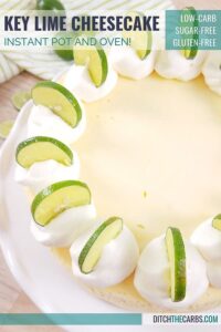 Baked low-carb key lime cheesecake decorated with whipped cream and sliced limes