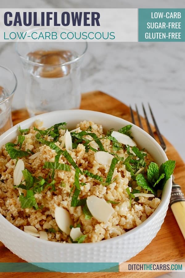 A bowl of low-carb cauliflower couscous with a glasses of water