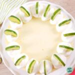 whole key lime cheesecake on a white plate