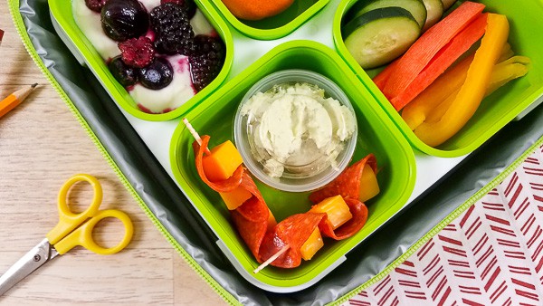 A plastic container filled with different types of healthy lunchbox ideas for children