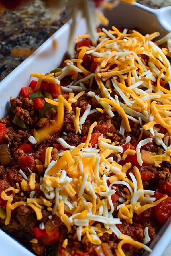 A dish is filled with keto chili with shredded cheese