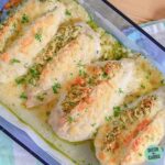 Two-Cheese Pesto Chicken in a glass baking dish