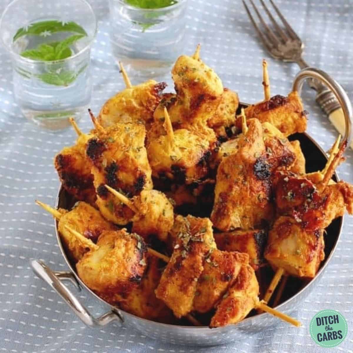 Keto chicken curry kebabs in a silver bowl