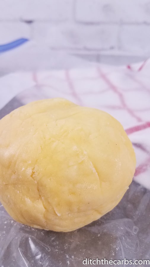 Pie crust dough ball in a mixing bowl