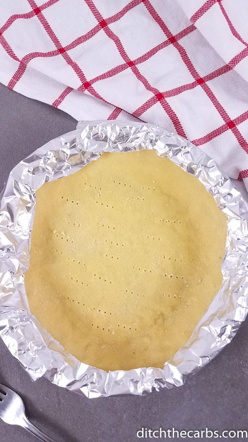Pie crust with the edges wrapped in foil so it won't burn