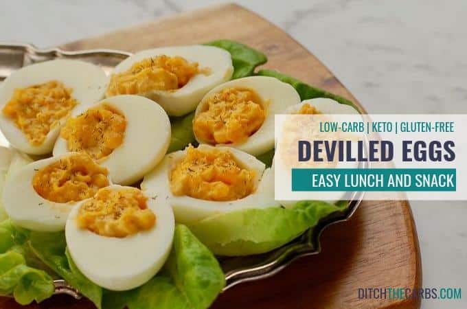 Devilled eggs served on lettuce and a antique silver plate