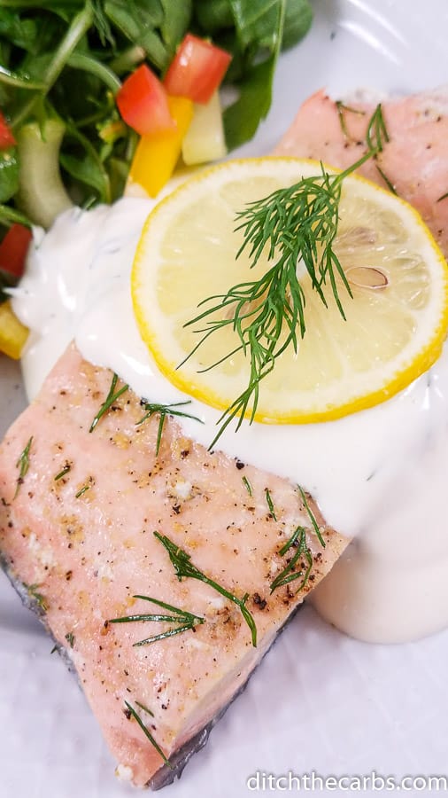 A plate of poached salmon with dill mayonnaise