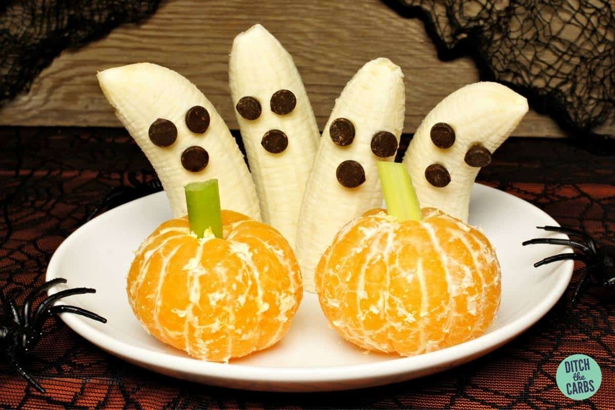 fruit carved to look like Halloween creatures