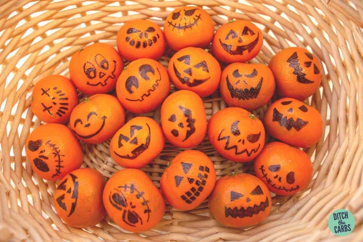 small oranges with Halloween faces