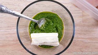 A bowl of pesto with cream cheese