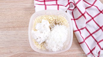 Cauliflower rice with coconut and coconut cream in a plastic container