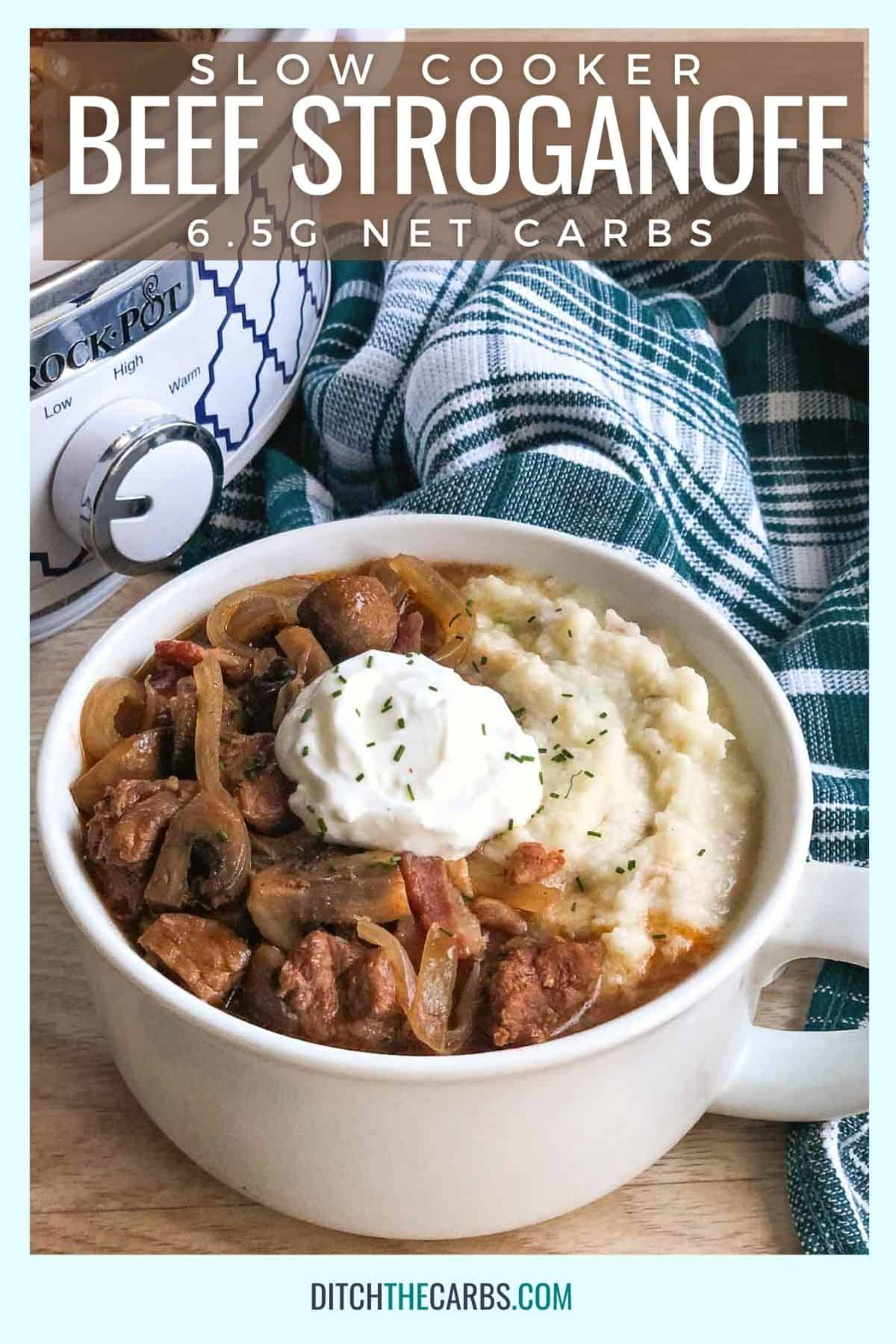 keto beef stroganoff in a white bowl with sour cream