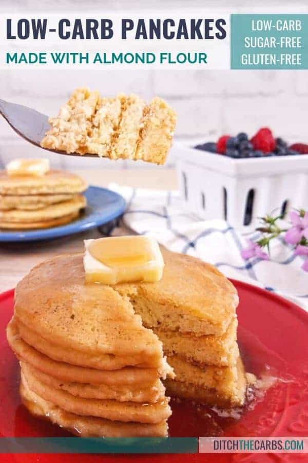Almond flour pancakes stacked and cut being eaten with a fork