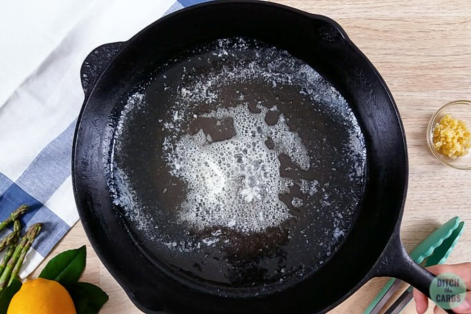 Cast iron skillet with melting butter