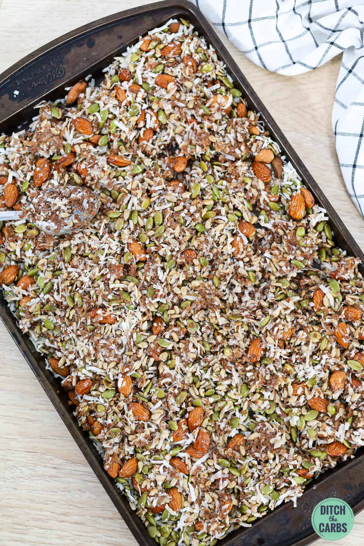 a baking tray with keto granola ingredients
