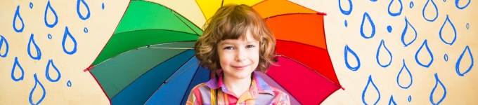 A child holding a colorful umbrella