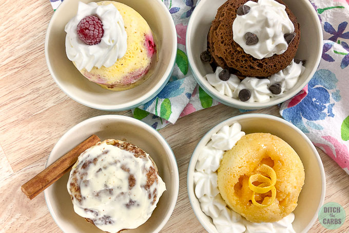 Four different low-carb mug cakes in bowls.