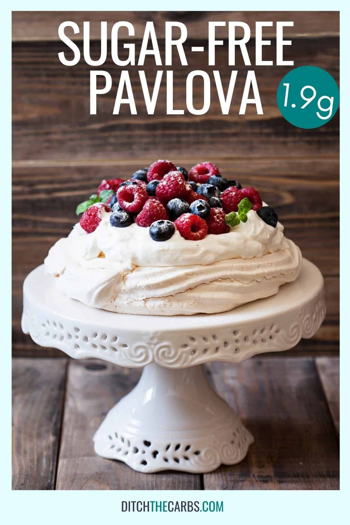 sugar-free pavlova with cream and berries on a serving plate