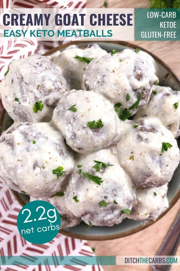 Creamy goat cheese keto meatballs being served in a blue stone bowl.