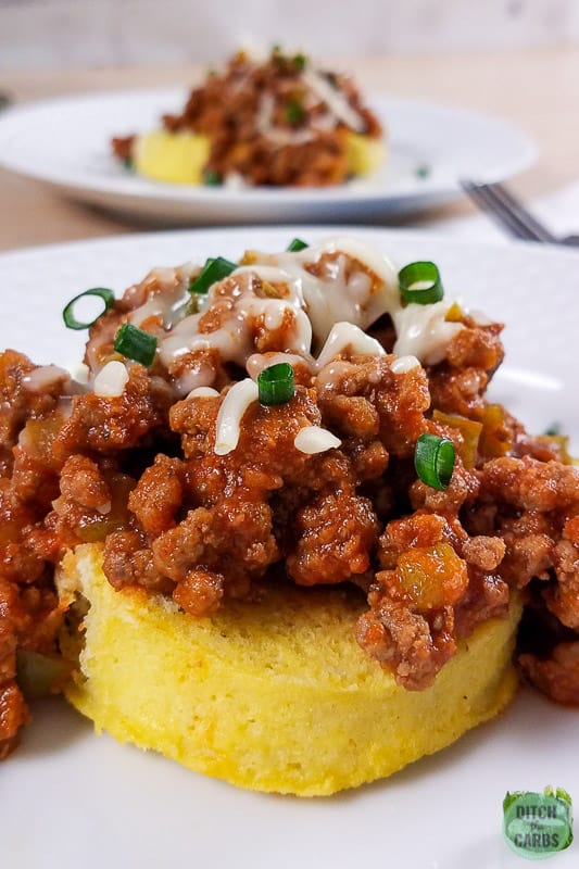 Low-Carb Sloppy Joes served over 1-minute muffins on white plate