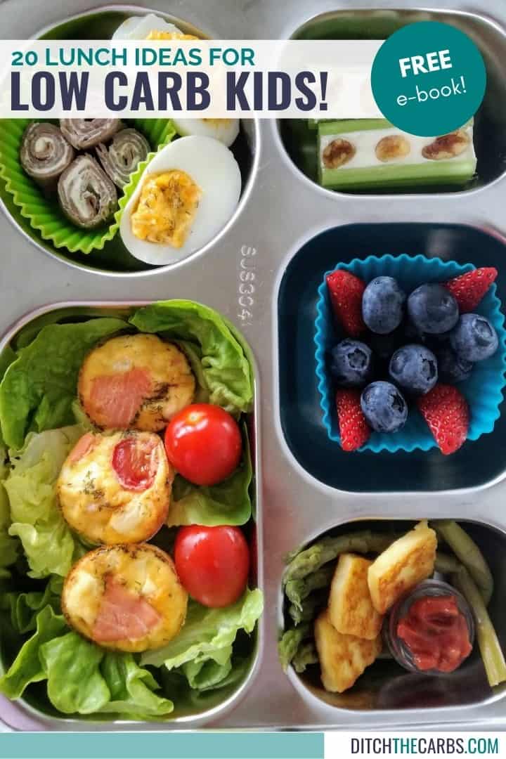 tin lunch tray with salmon bites, berries, asparagus, deviled egg, and celery