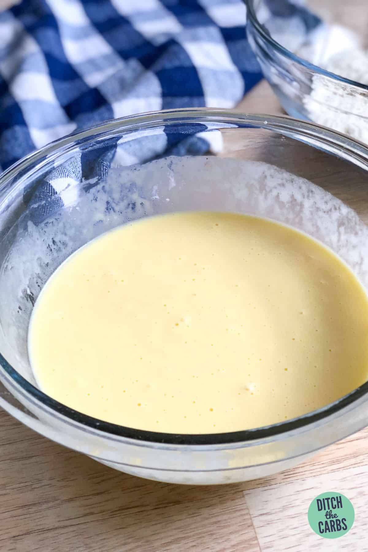 egg and milk mixture in a glass bowl