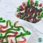 red and green gummy bears on a white plate