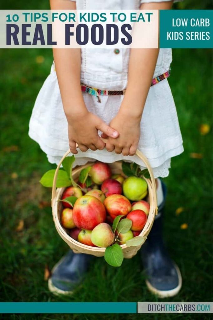 young girl with a basket full of apples