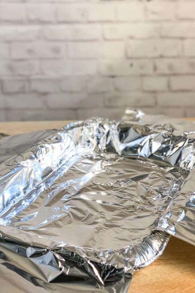 Foil and aluminium lined roasting tray