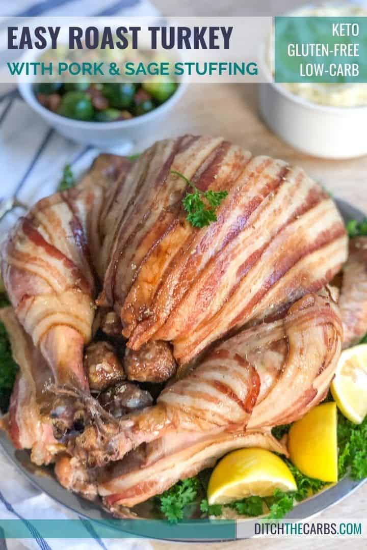 a bacon-wrapped turkey served with a slice of lemon on a silver dish
