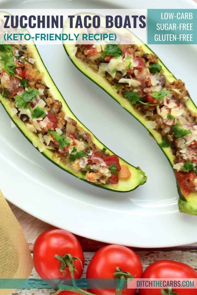 2 cooked zucchini taco boats on a white plate and served with salsa and cheese